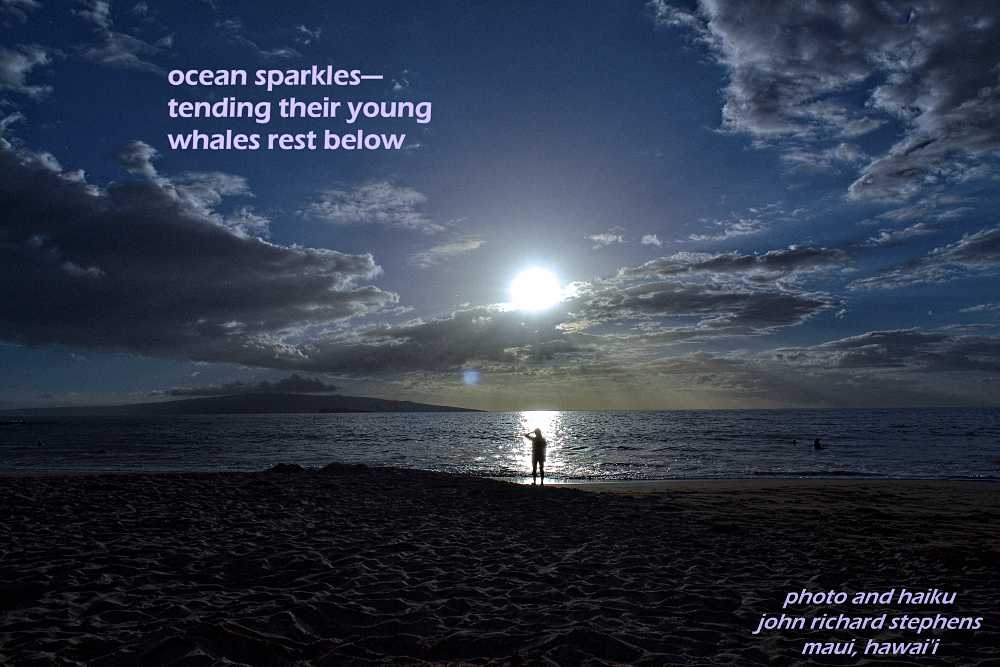 A photo haiku with a picture of sun shining through clouds with a reflection on the ocean shining down to a woman on a beach.